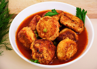 Small meat balls with peas and parsley. Fried noisettes