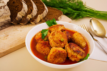 Small meat balls with peas and parsley. Fried noisettes with and rye bread