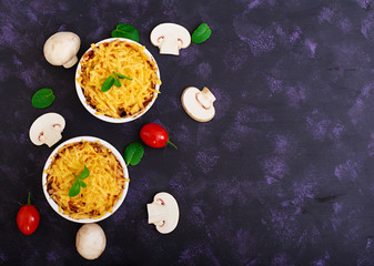 Julienne with chicken and mushrooms. Top view