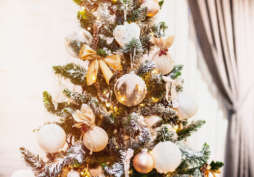 Christmas tree with Christmas decorations in a home room interior