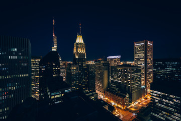 Fototapeta na wymiar View of buildings in downtown at night, in Baltimore, Maryland.