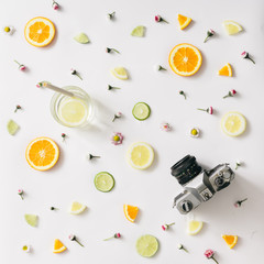 Colorful pattern made of citrus fruits and flowers. Flat lay