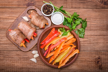 Baked chicken rolls with  paprika . Concept of cooking.