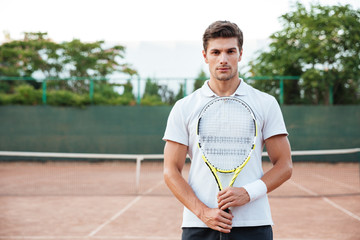 Portrait of tennis player man