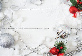 New Year Christmas wooden white background with balls and tinsel