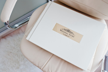 White classic photo album or photobook with golden frame with si