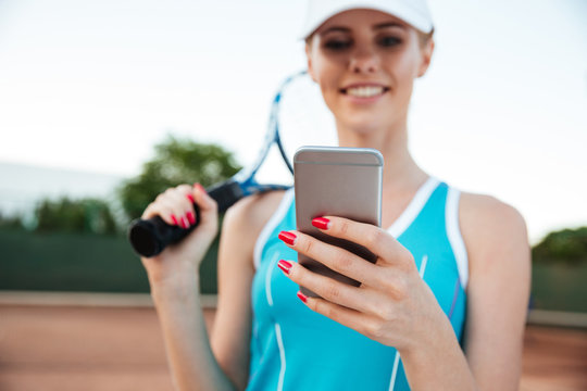 Young Tennis Woman With Phone