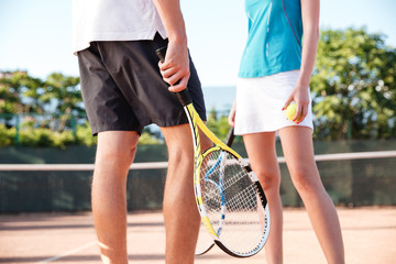 Legs of tennis couple