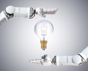 the metal robot hand with light bulb