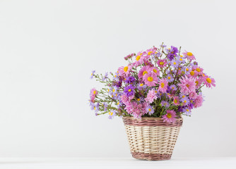 flowers in a basket on white background