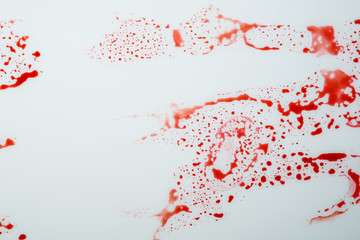 Blood drips on white surface