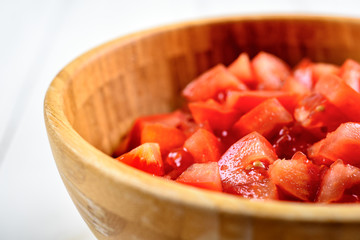Chopped Tomatoes In Wood Bowl