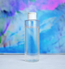 beauty tonic on a blue background. The concept of cosmetics 