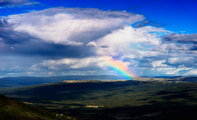 Naklejka na ściany i meble Rainbow in Norway mountains landscape background