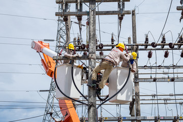 electrician repair the transmission system.
