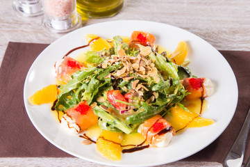 salad with red fish and orange