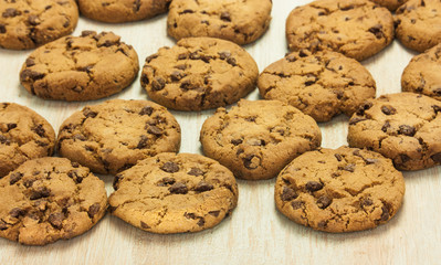 Chocolate chips cookies pile closeup, selective focus