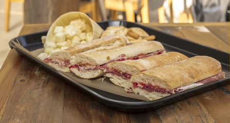 Tray with jamon sandwiches and cheese cubes, Spanish tapas