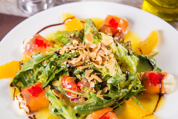 salad with red fish and orange
