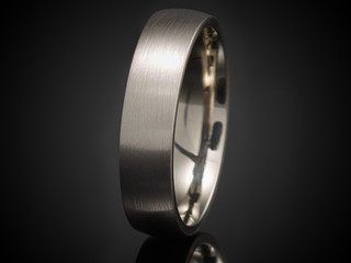 beautiful silver ring isolated on black background