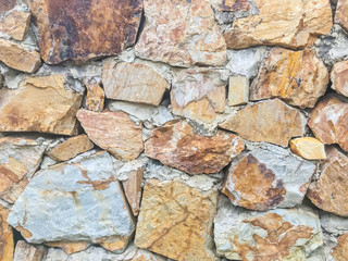 Closeup surface brick pattern at old stone brick wall textured background