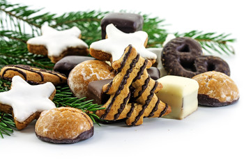 Christmas cookies and fir branches, gingerbread cakes on a white background