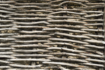 Old wicker wooden wall closeup
