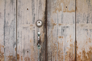 Fototapeta premium Old Wooden Door Lock Plank Background Board Design