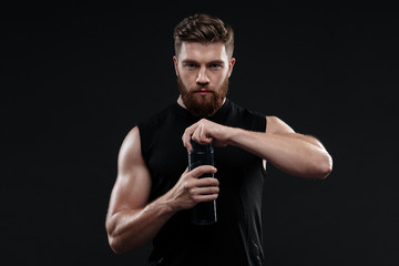 Athletic man with bottle