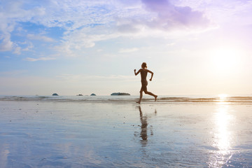 Healthy lifestyle, fitness and sport concept, young women are jogging on sunset sea beach.