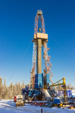 oil drilling rig land onshore blue sky winter