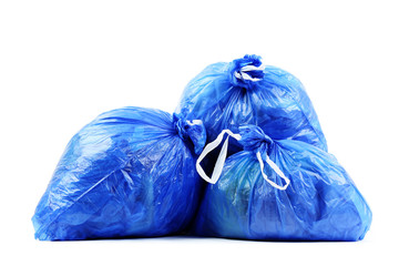 Blue rubbish bags isolated on white