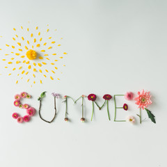 Word "SUMMER" made of flowers on bright background