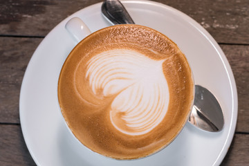 Coffee Cup on Wood Background
