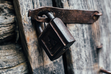 padlock on the old wooden door