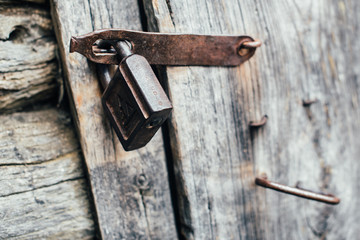 padlock on the old wooden door