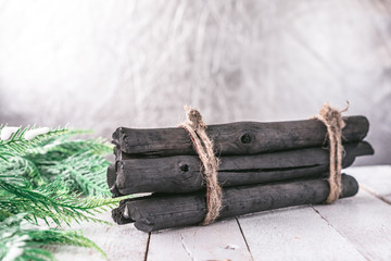 Firewood with Fir tree on wooden table