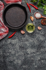 Background with spices, herbs, olive oil and pan for cooking.