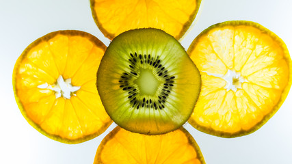 Soft focus,Abstract background with silhouette citrus-fruit of orange and kiwi slices. Close-up....