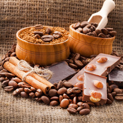 Cup full of coffee beans on the cloth sack