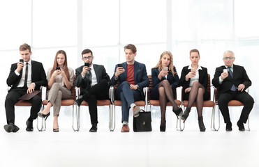 Fototapeta premium Employees carefully listening to their boss at a business meeti