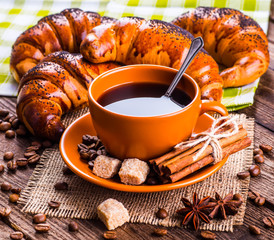 Coffee cup and coffee beans on table