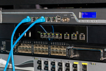 Telecommunications rack with switches and firewalls