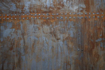 rusty metal with rivets