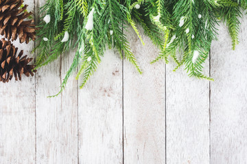 Top view of Fir tree with Pine cones on wooden table