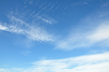 Naklejka na ściany i meble White clouds on the blue sky ripple