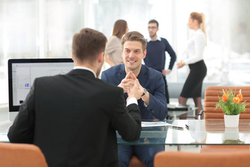 Business people sitting at corporate meeting