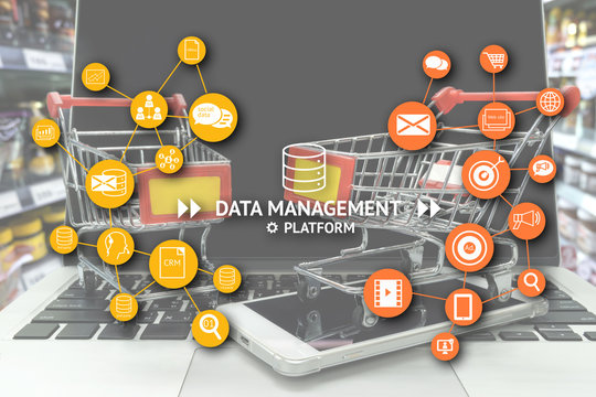 Data Management Platform (DMP) , Marketing and crm concept. Infographic , texts and icons with two shopping carts on smart phone and laptop in retail shop , supermarket or hypermart background