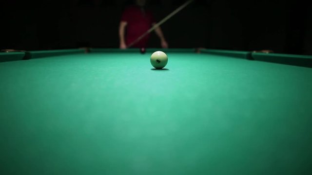 billiard balls on green baize in the game of pyramid