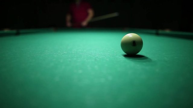 billiard balls on green baize in the game of pyramid